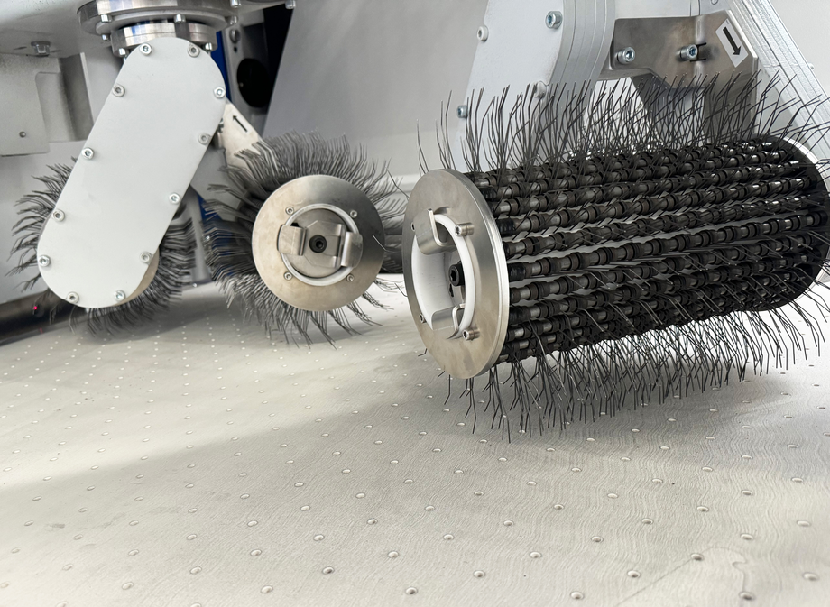 Oxide brush metal part being processed